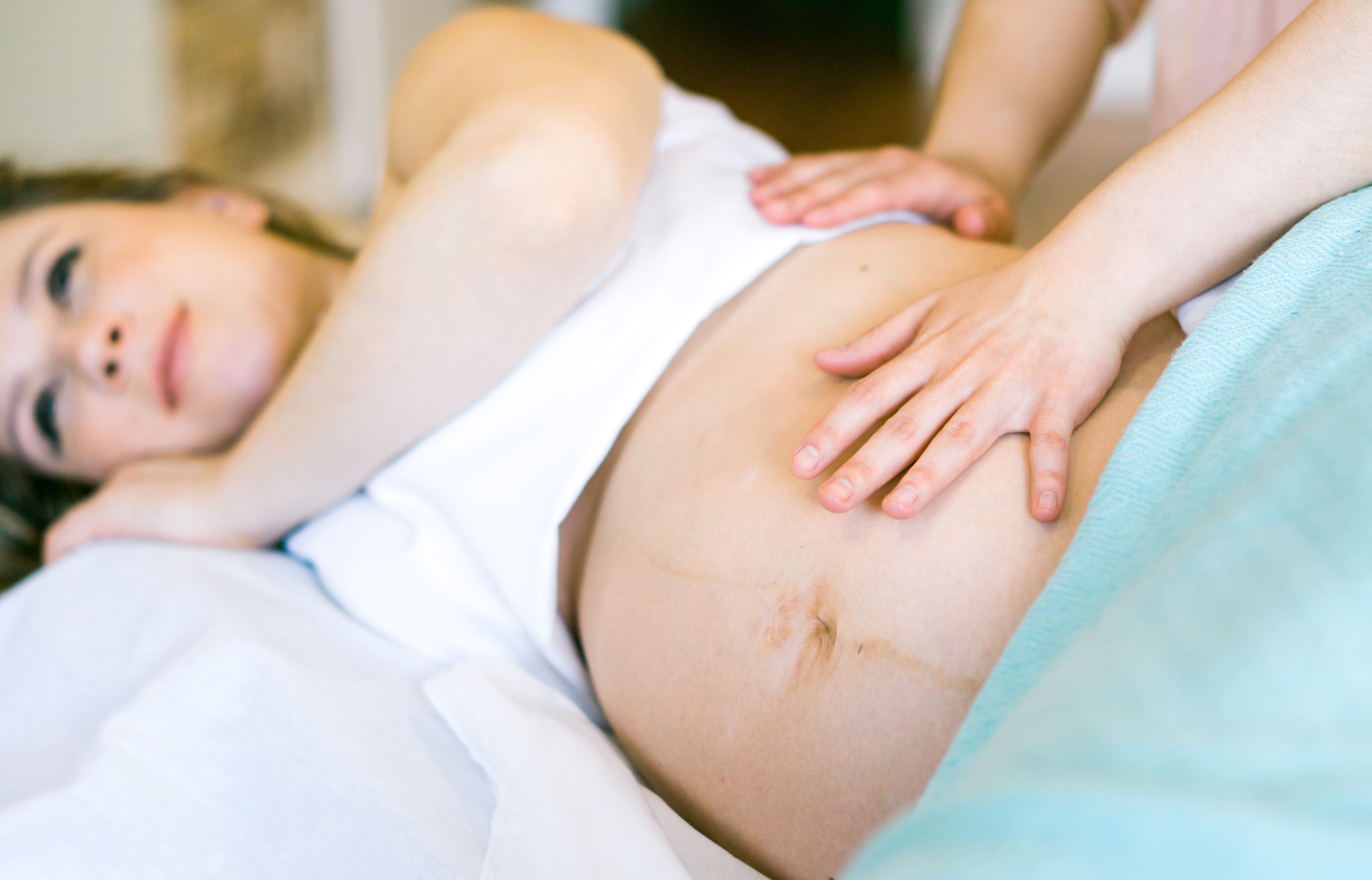 Picture of a pregnant woman receiving a prenatal massage